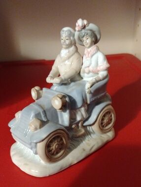 Porcelain/Ceramic Couple in the car figurine
